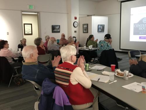 Members listen to Drake Brownfield