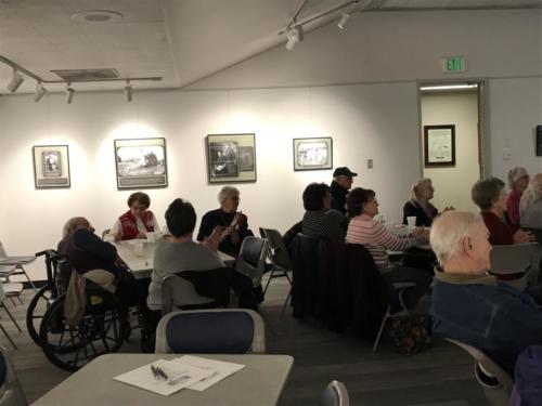 Members listen to Drake Brownfield