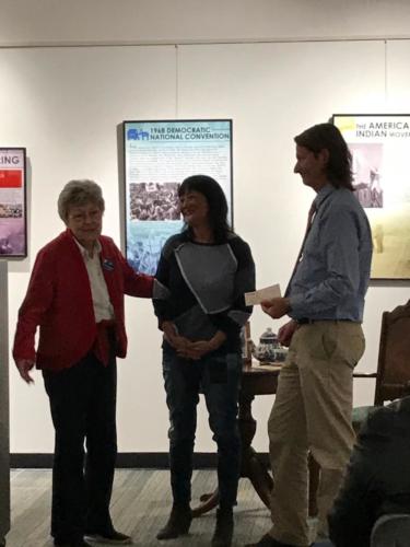 Sandy presents donation to the Aurora History Museum in memory of Mayor Hogan